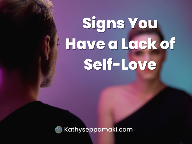Signs You Have A Lack of Self-Love Blog Post Title with a Picture of a Woman Looking at herself in the mirror with an unhappy look on her face.