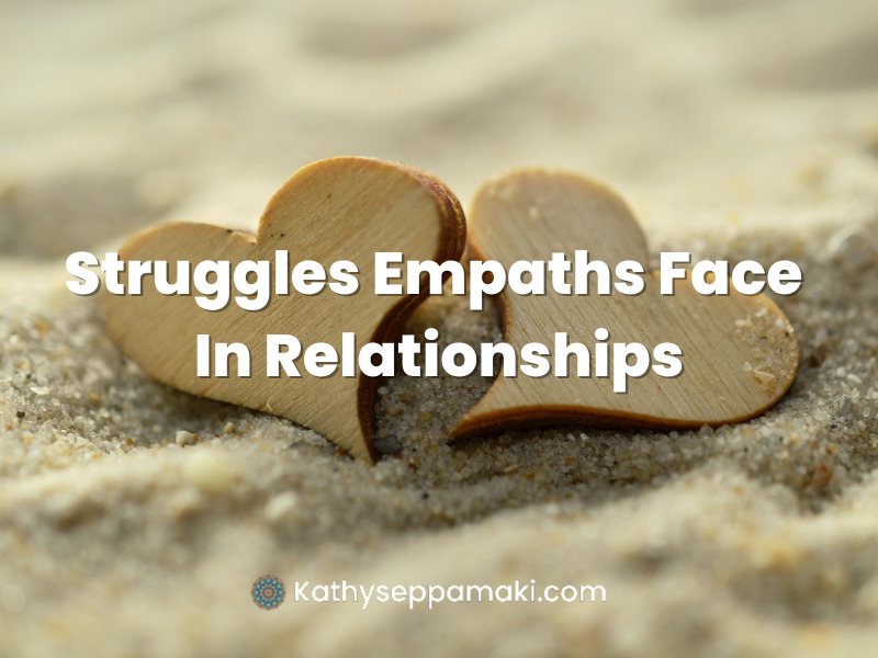 The Struggles Empaths Face in Relationships Blog post title with picture of two hearts touching one another sitting on the sand.