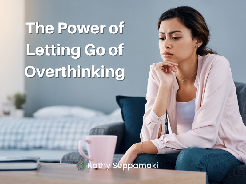 The Power of Letting Go of Overthinking- Woman sitting on her couch looking like she's in serious thought