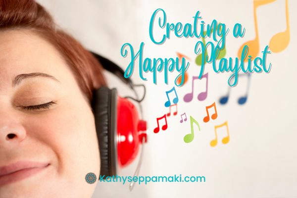 Creating a Happy Playlist blog post title with a picture of a smiling woman with her eyes closed wearing headphones