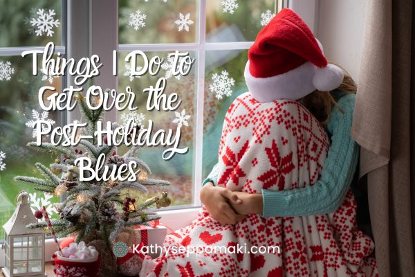 Things I do to get over the post holiday blues blog post with picture of a woman sitting with her knees pulled up. She's buried her face in her knees. There is a small Christmas tree next to her and she's wearing a Santa hat