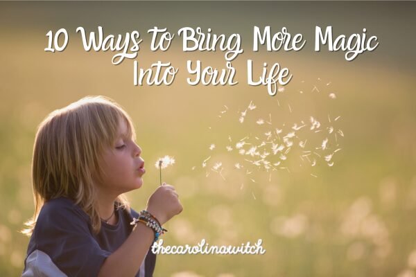 10 Ways to Bring More Magic Into Your Life blog post title with picture of a young child blowing on a dandelion that has gone to seed.